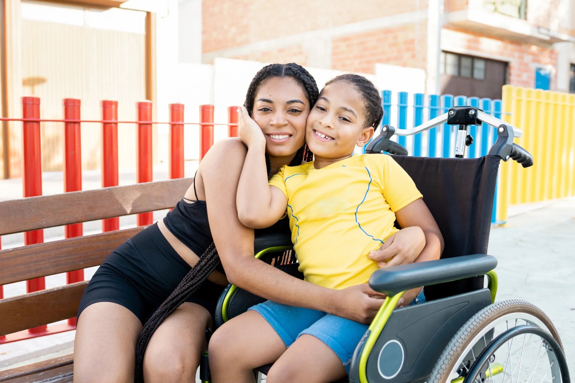 Caregiver with child in wheelchair