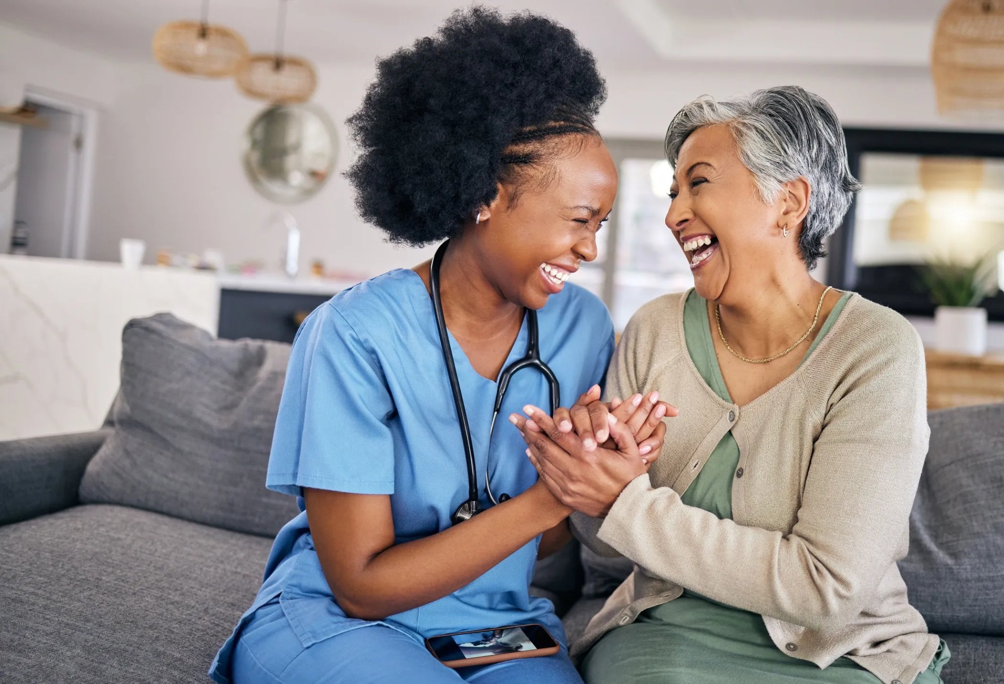 Nurse and patient laughing together